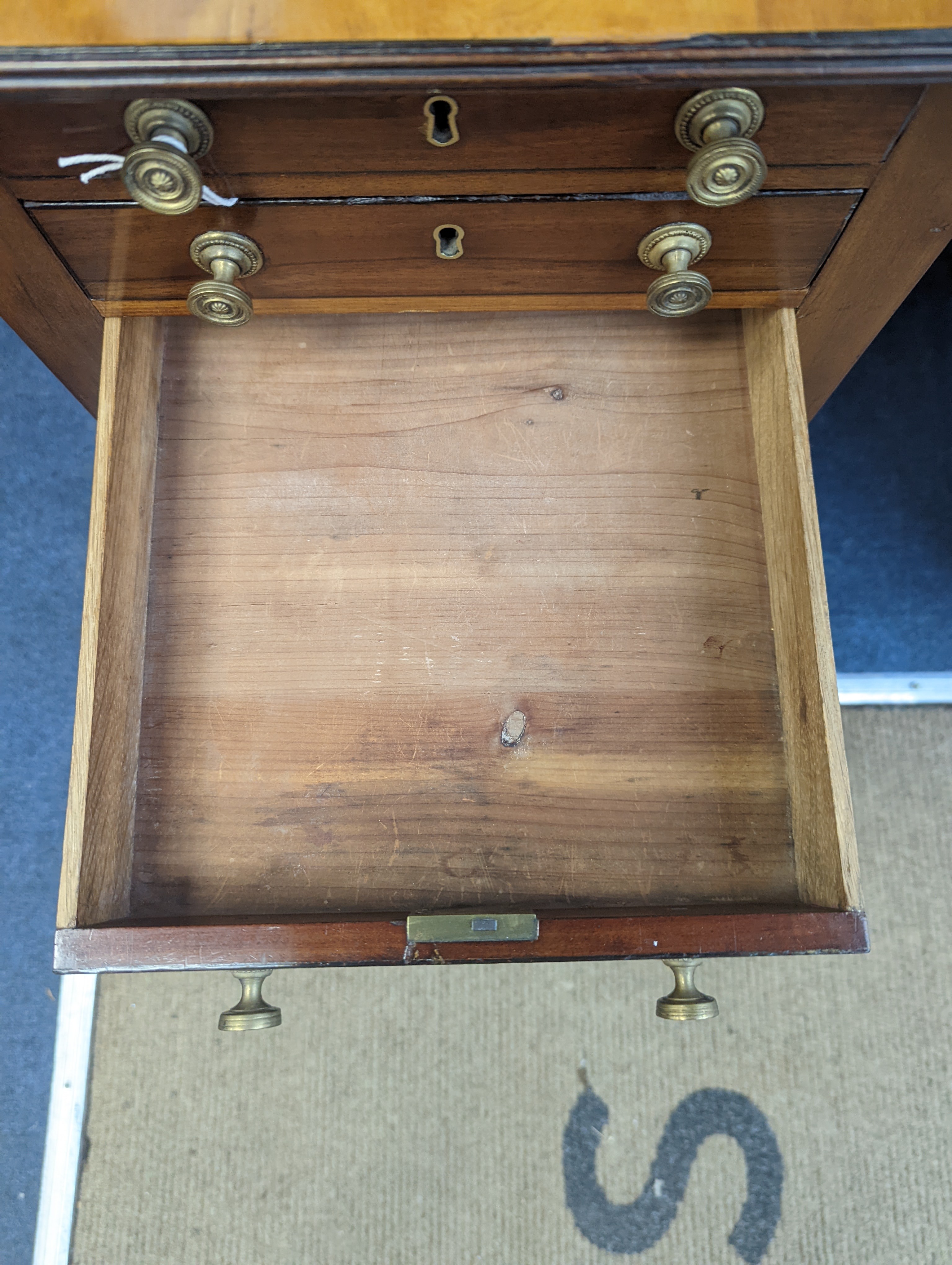 A Regency satinwood banded mahogany drop flap work table, width 69cm extended, depth 46cm, height 76cm